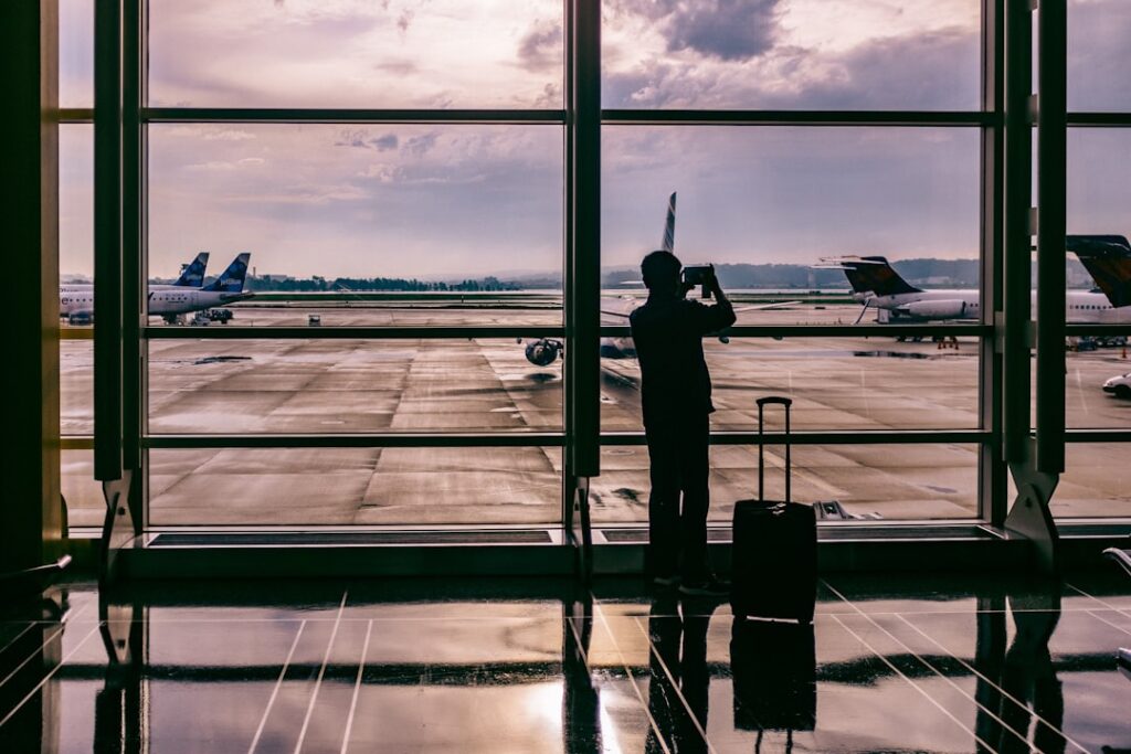 Traveler with smartphone at airport