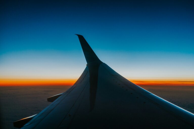 Long Weekend Trip — Airplane Window Sunset